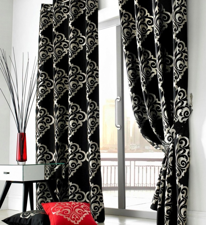 contemporary-white-living-room-with-glass-door-and-black-curtains-floral-pattern-915x999